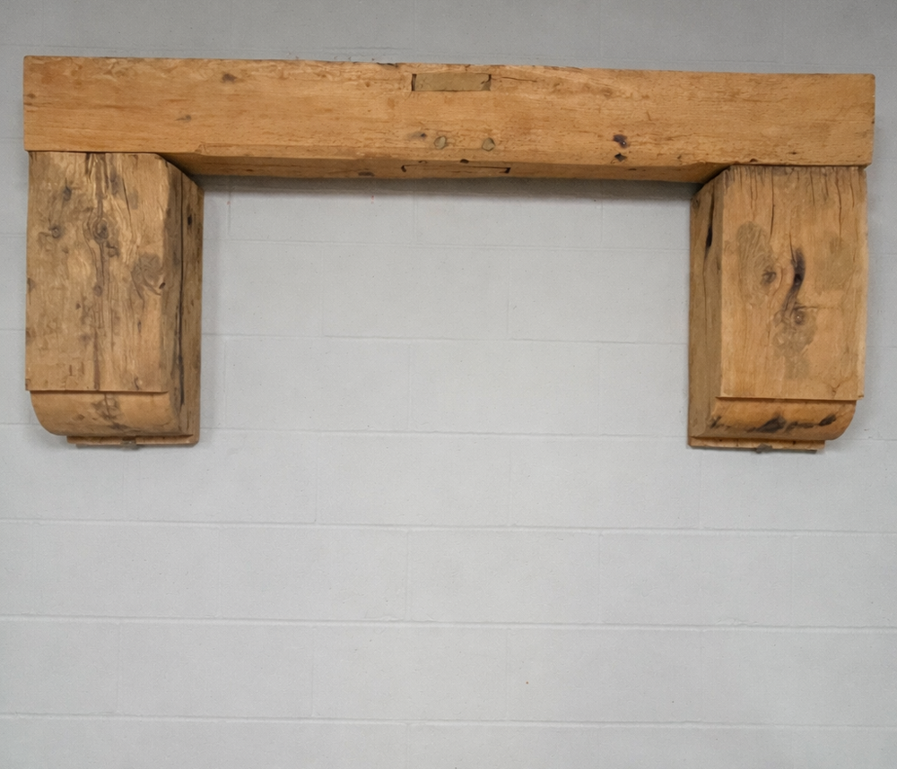Rustic wooden lintel on grey wall | Timber Mantel